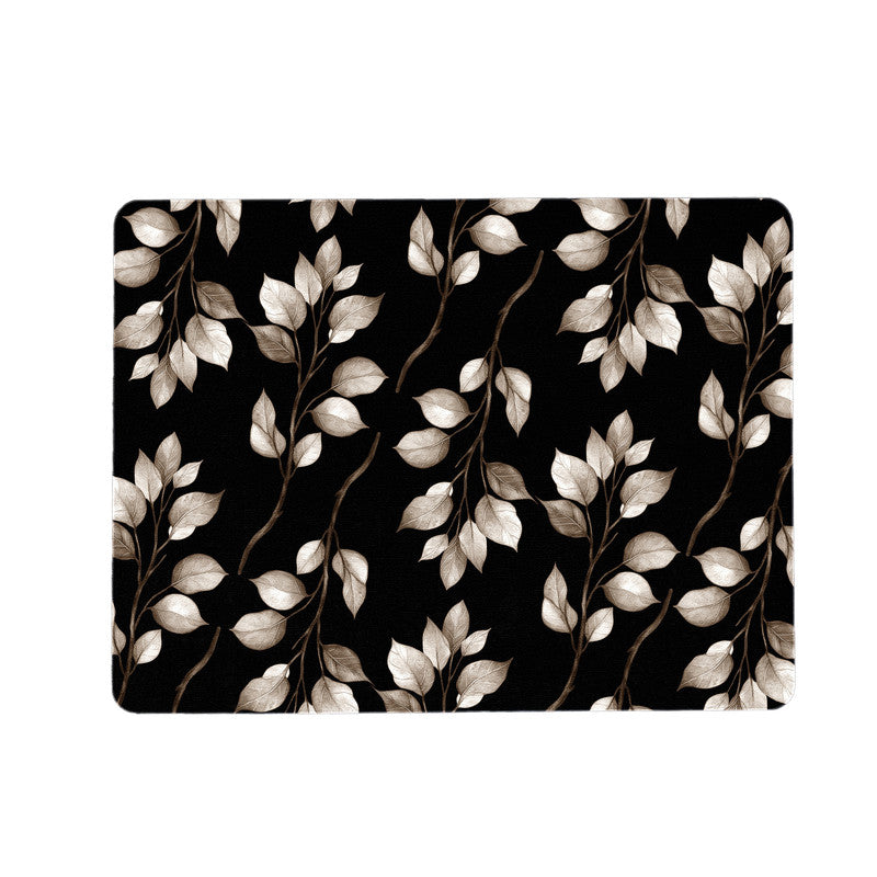 Dark Brown Leaves on Black Placemats by Mark van Vuuren