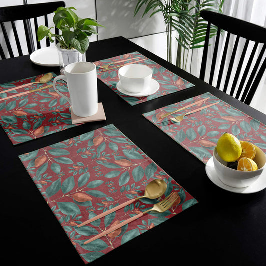Green Leaves on Red Placemats By Mark Van Vuuren