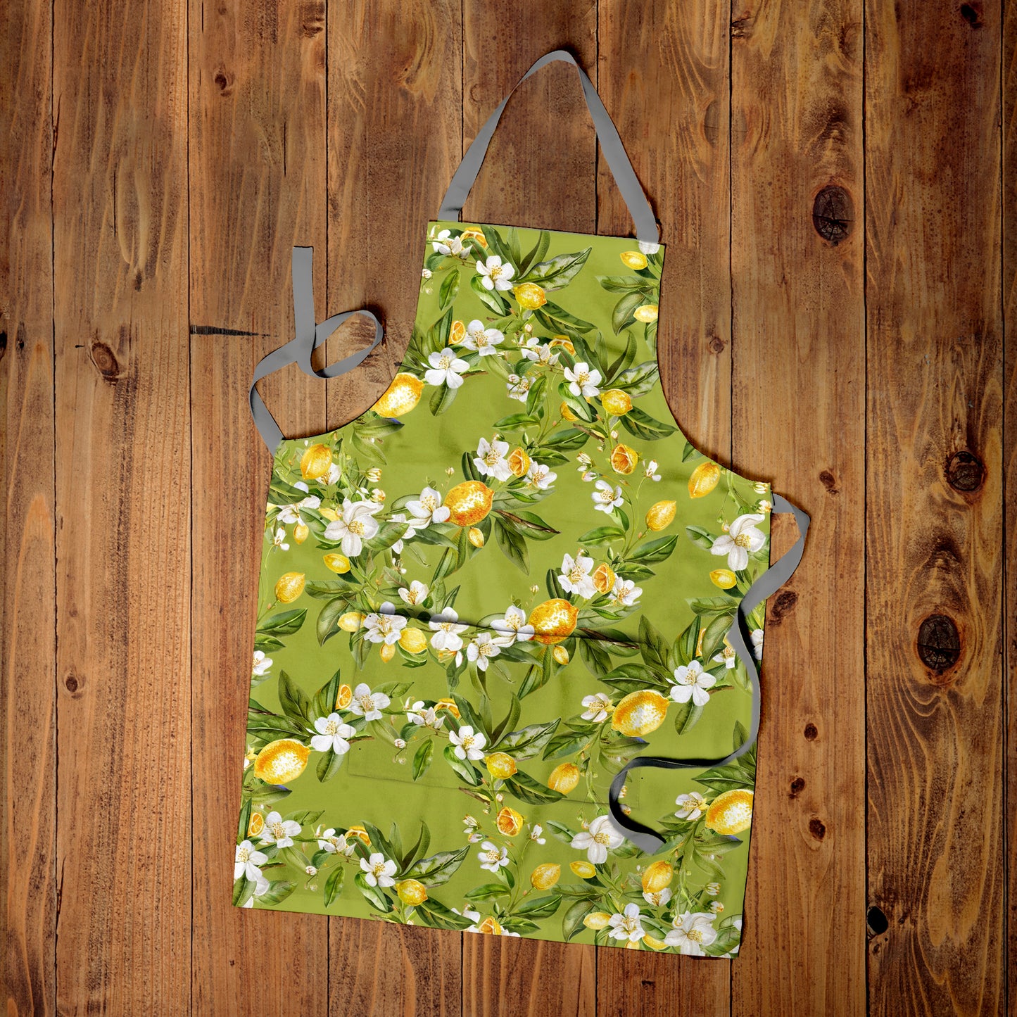 Lemon On Green Apron by Mark van Vuuren
