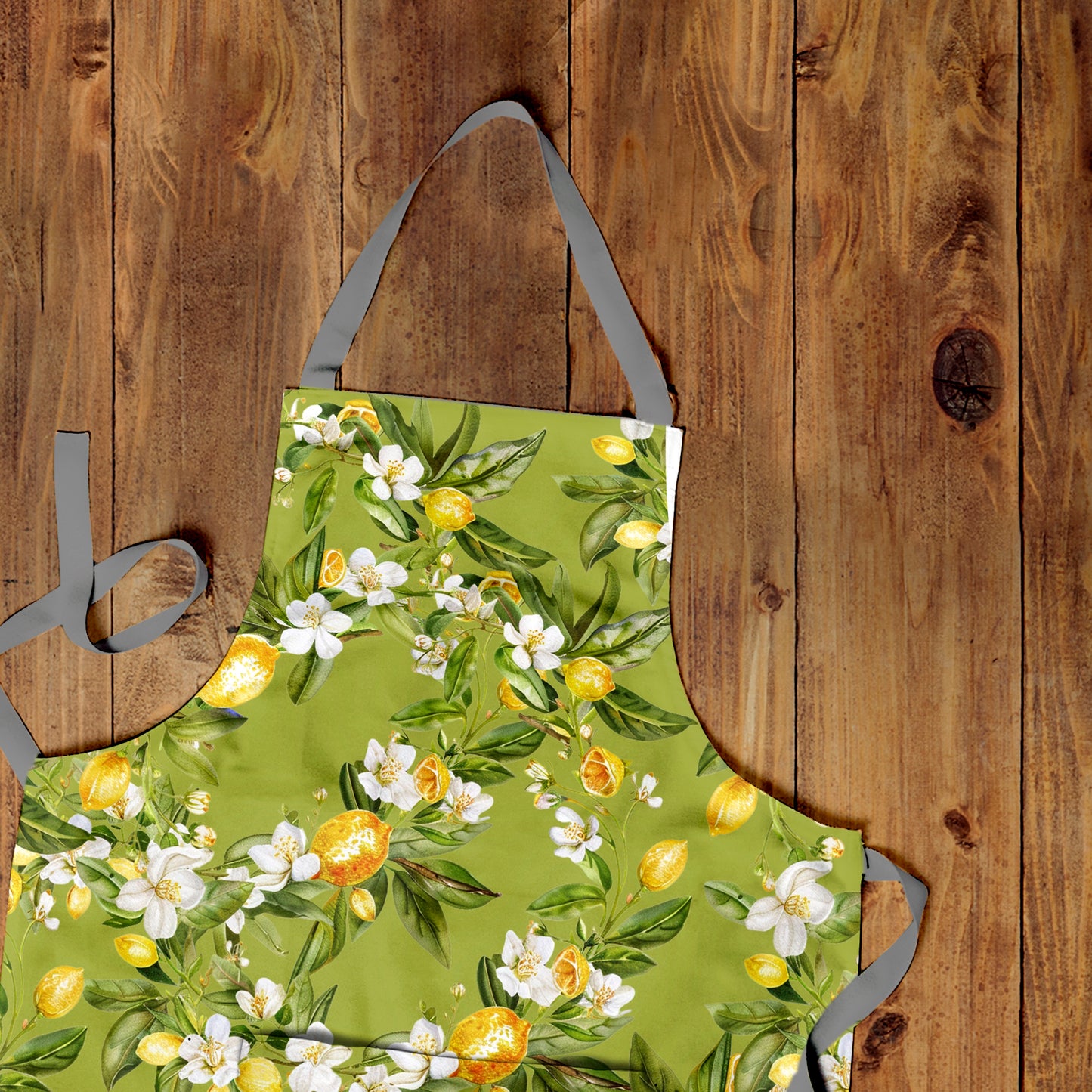 Lemon On Green Apron by Mark van Vuuren