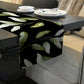 Light Green Leaves on Black Table Runner by Mark van Vuuren