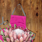 Pink Protea on Pink Apron by Mark van Vuuren