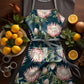 Proteas on Teal Medium Length Apron By Mark Van Vuuren