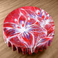 Shadow of White on Red Round Tablecloth